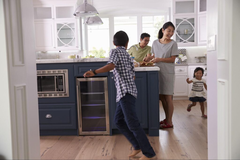 children running around a kitchen