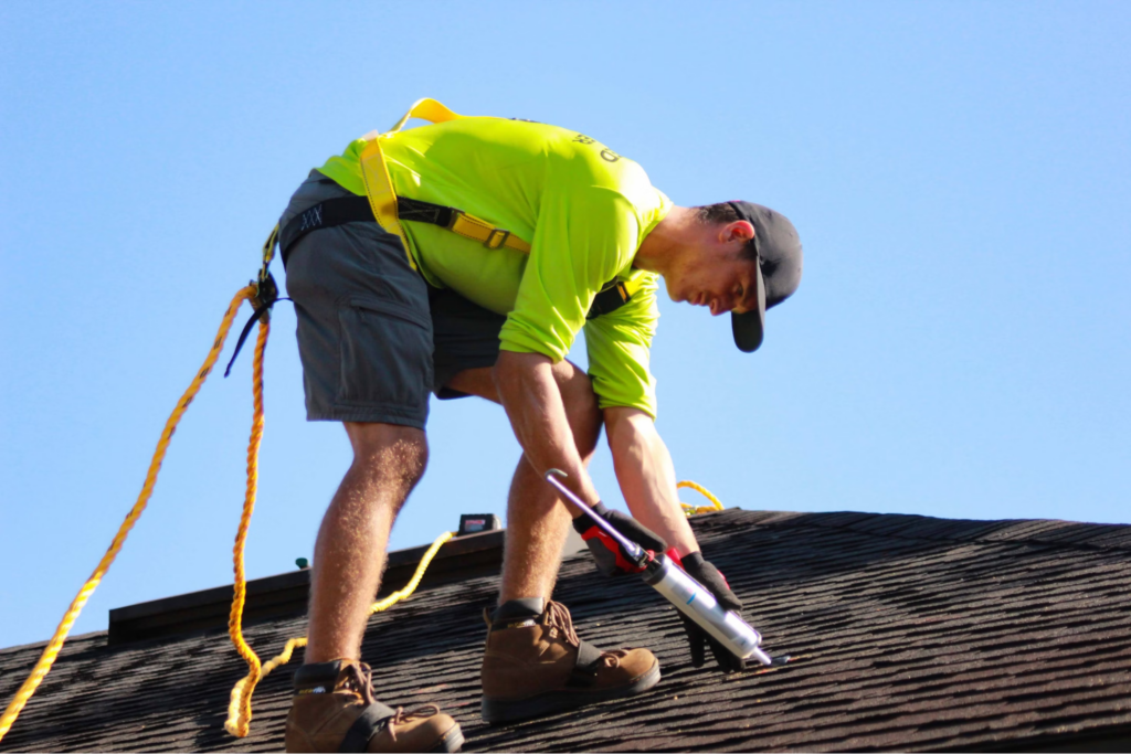 FHIA contractor caulking a roof
