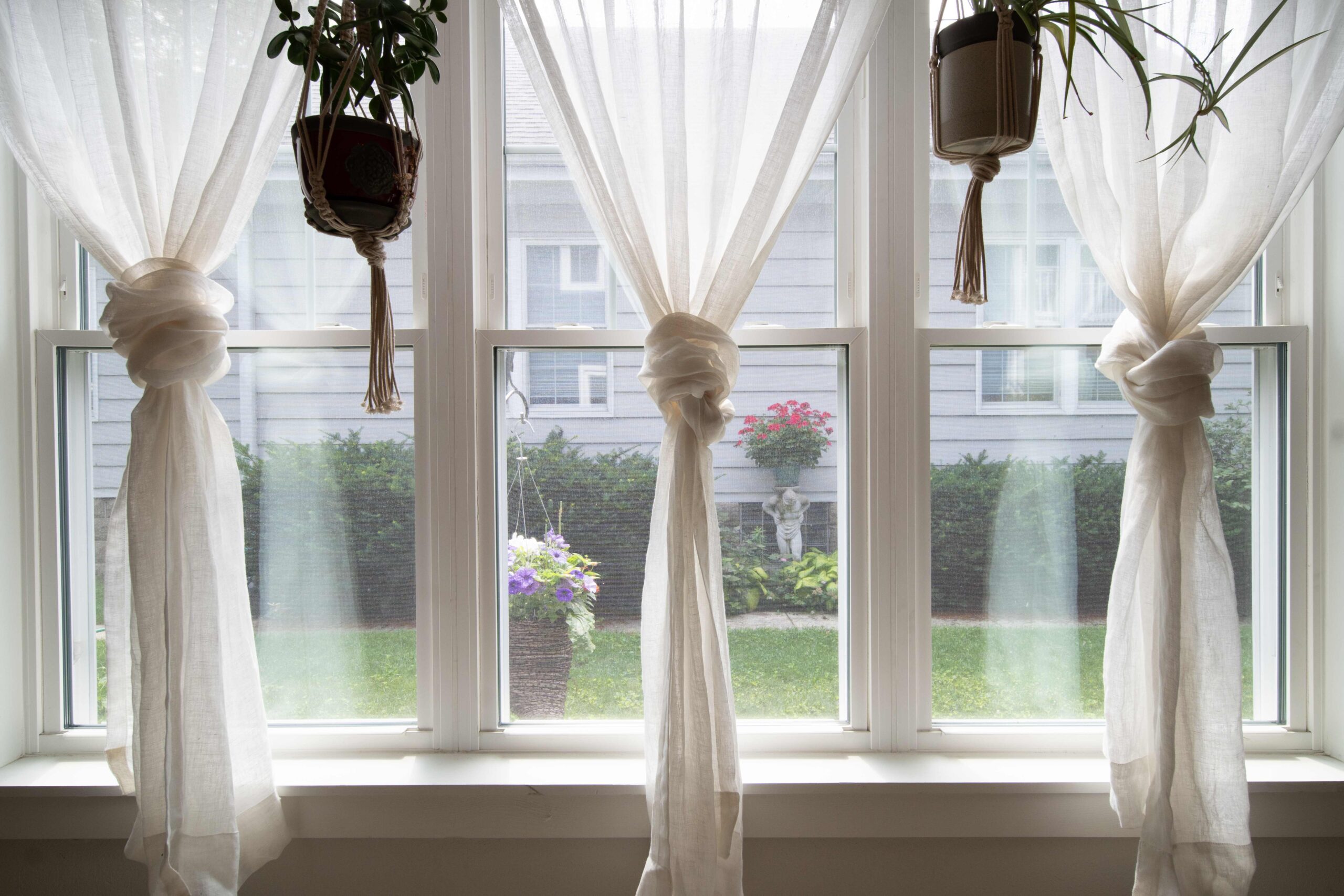 white vinyl window with curtains