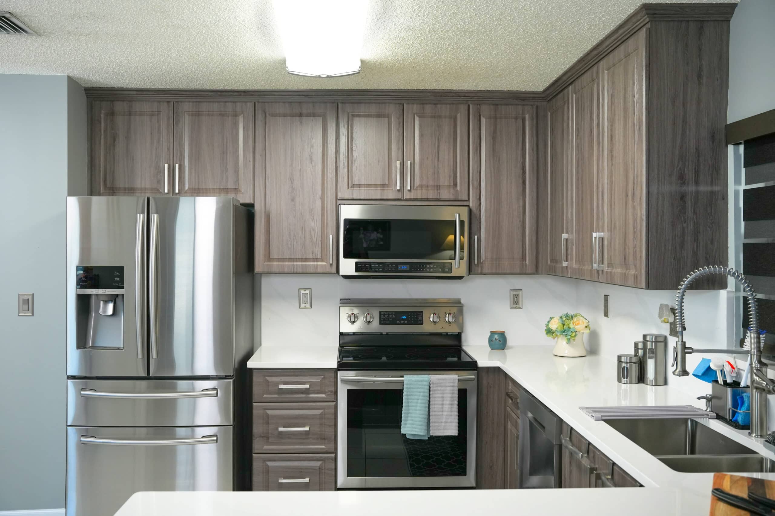 dark gray cabinets with bright white countertops