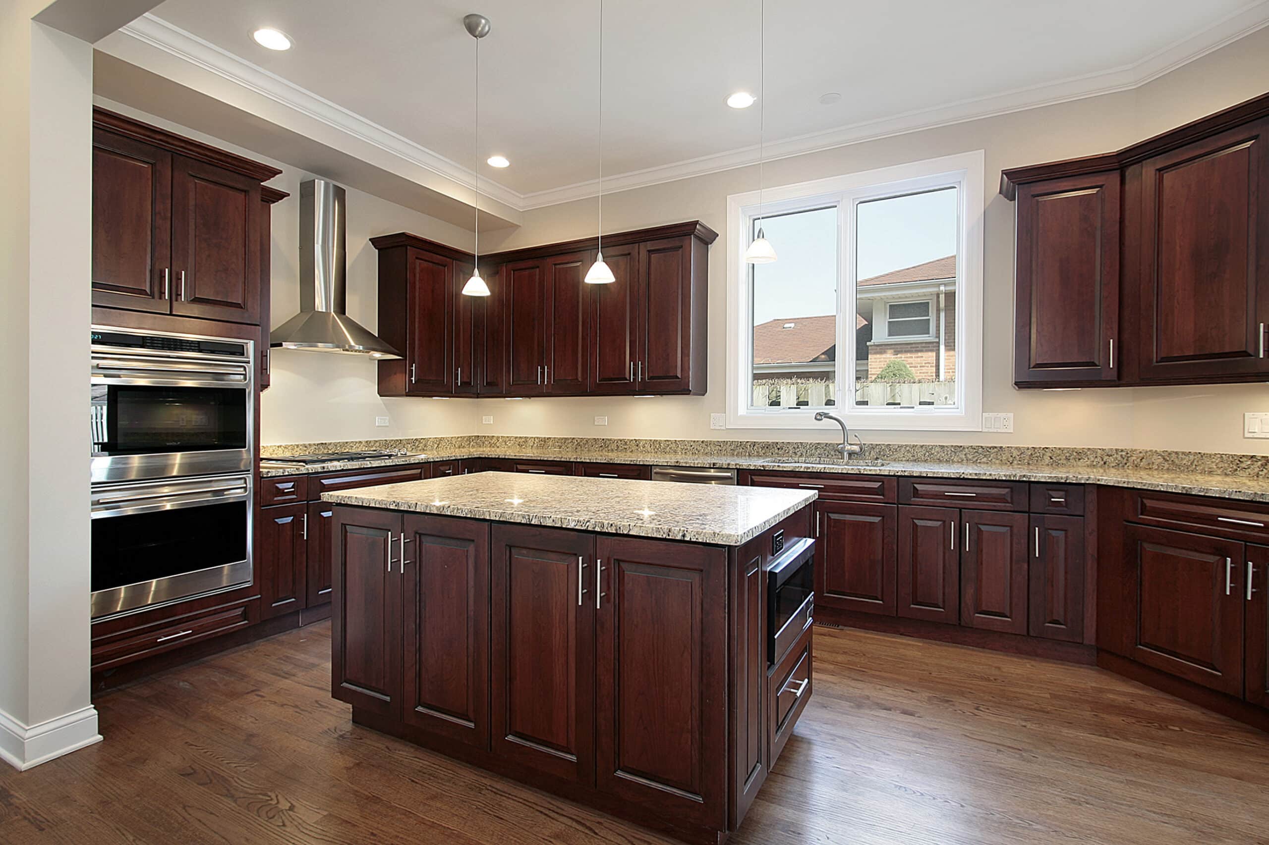 dark wood cabinets with bright marble countertops